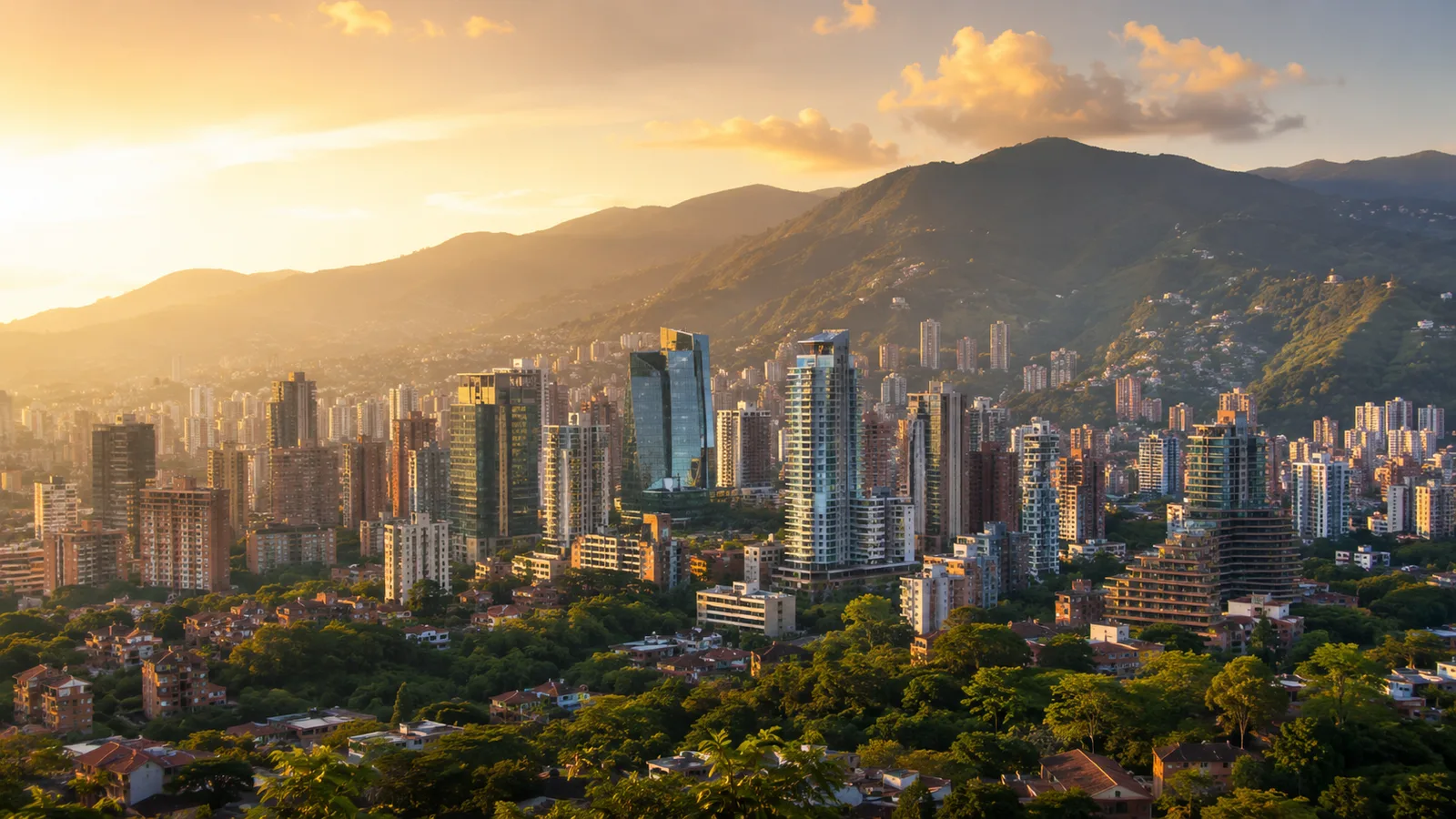 Medellín skyline at golden hour with green mountains